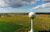 Water Tower with a field behind it